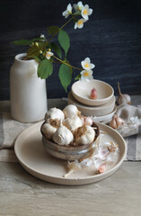 Close-up of garlic and seashells on table