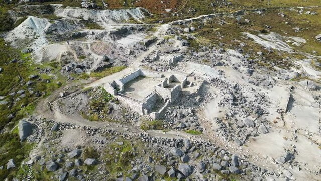 Drone shot above the abandoned 150 year old miners' village at the top of the Wicklow Gap, Ireland.