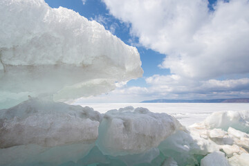 Lake Baikal, Irkutsk region, Russia. Beautiful view of frozen Lake Baikal covered with ice. Ice...
