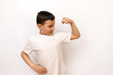 The guy strained his muscles, showing off his biceps. Healthy lifestyle and sports.