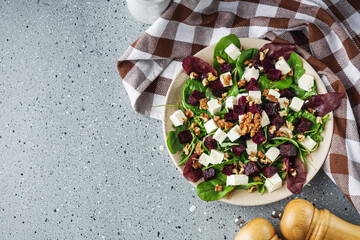 delicious fresh beet salad on a light stone background