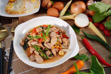 Stir-fried pork with basil, Thai food, fresh vegetables, ingredients on the table
