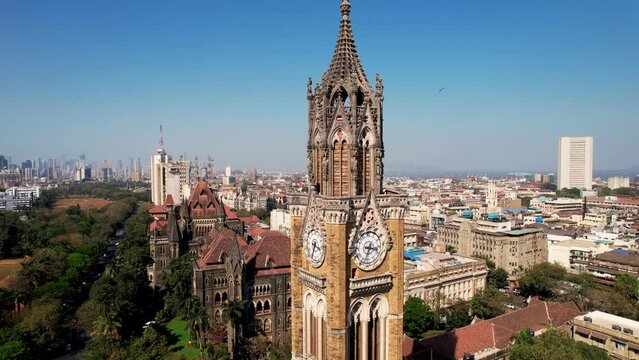 Aerial view of Rajabai Clock Tower in Mumbai, India, Colaba district. 1878 clock tower modeled after Big Ben. Victorian architecture in India