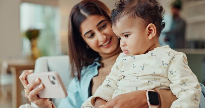 Mom, baby and phone with video in a family home for education, learning and development growth. Online, mobile app and couch in a living room with child cartoon and mother smile on the internet