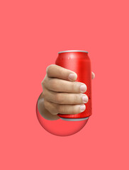 Man holding aluminum can with water droplets on color background