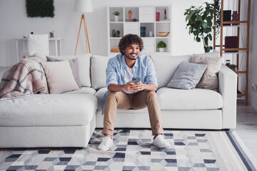 Photo of funky positive man wear checkered shirt texting modern gadget staying home indoors house...