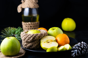 Fresh ripe green apples on wooden table against dark background, space for text