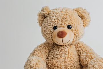 Obraz premium Adorable teddy bear on white, evoking feelings of childhood comfort and nostalgia