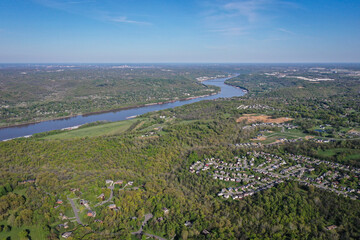 Ohio River near Cincinnati between Ohio and Northern Kentucky with suburbs and rural farm areas.