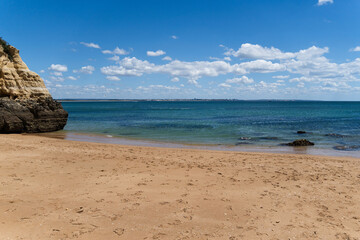 Praia dos Estudantes beach in Lagos, Algarve, Portugal. Sunny day, crystal clear and blue sea. Student beach