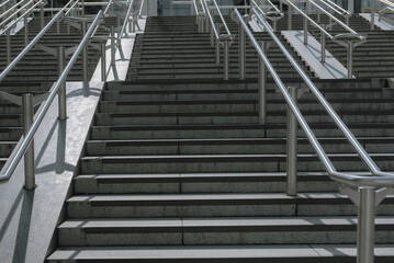 Fototapeta premium Beautiful stainless steel handrails are installed on the walls and steps at football stadium.