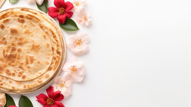 Top View Middle East Canai or Paratha Flat Bread, or also known as Roti Maryam in Indonesia with flower on white background