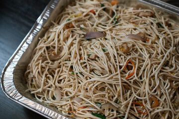 Freshly fried rice noodle, a symbol of celebratory occasions like birthdays, ready to be enjoyed as a classic Asian delicacy.