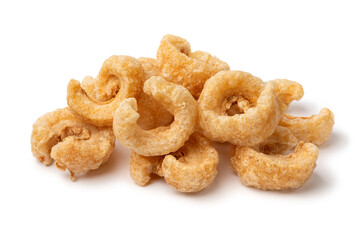 Heap of traditional fried pork rind isolated on white background close up
