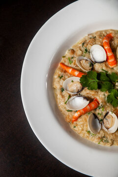 Traditional Portuguese seafood dish, a&ccedil;orda de marisco, served in a rustic bowl, showcasing a flavorful blend of seafood, bread, and aromatic spices.