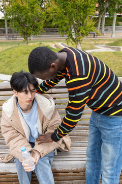 Man assists friend during hypoglycemic episode in park