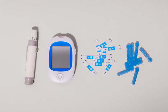 Diabetes management tools on a light background
