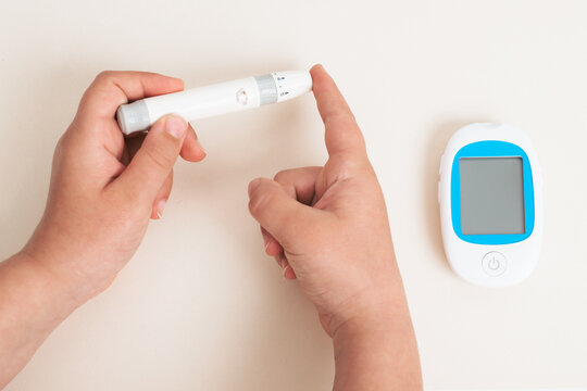 Checking blood sugar level with glucose meter