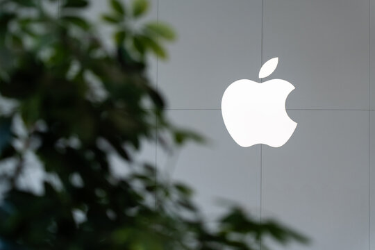 SINGAPORE - OCTOBER 10, 2023: Apple logo adorns the wall of Apple Store.