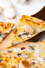 Tasty fresh baked pizza with champignons and chicken fillet