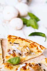 Tasty fresh baked pizza with champignons and chicken fillet