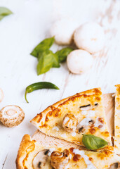 Tasty fresh baked pizza with champignons and chicken fillet