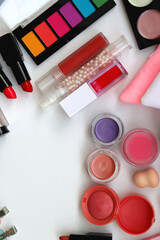 Various colorful beauty products on white background. Top view.