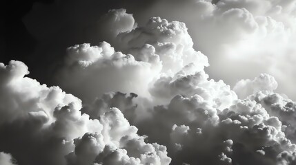 A grayscale image of clouds. The clouds are fluffy and have a lot of detail.