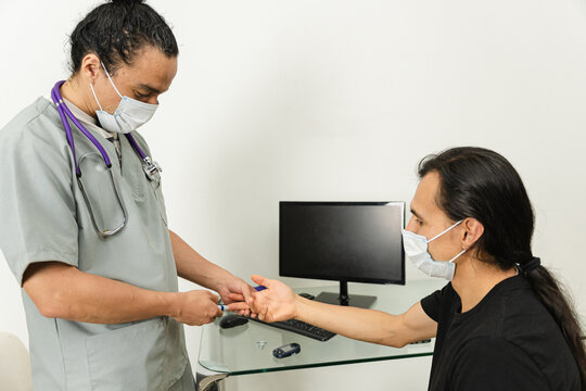 Doctor conducting a glucose test for hypoglycemia diagnosis