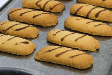 Kue lidah kucing or cat's tongue cookies. traditional cookies for eid holiday in indonesia. kue lebaran.