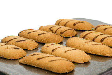 Kue lidah kucing or cat's tongue cookies. traditional cookies for eid holiday in indonesia. kue lebaran.