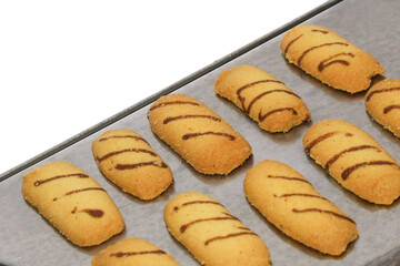 Kue lidah kucing or cat's tongue cookies. traditional cookies for eid holiday in indonesia. kue lebaran.