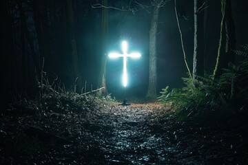 Mysterious illuminated cross shines amidst the eerie darkness of a mistcovered forest