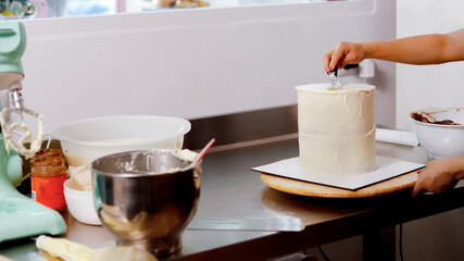 Decorating a cake with precision and care