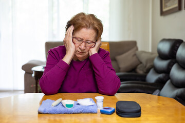 Elderly woman managing hypoglycemia symptoms at home
