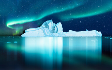 Iceberg floating in greenland fjord  
with aurora borealis - Greenland