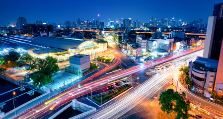 Bangkok railway station( Hua Lamphong) with lights of cars at twilight in Bangkok, Thailand.