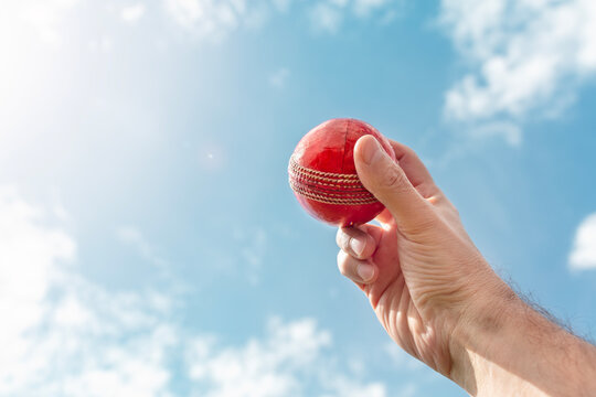 Cricket bowler bowling with ball in hand