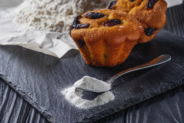muffins baked with baking powder on a black wooden rustic background