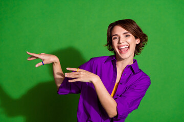 Photo portrait of funny young woman in purple stylish shirt and brown bob haircut dancing doing...