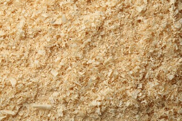 Dry natural sawdust as background, top view
