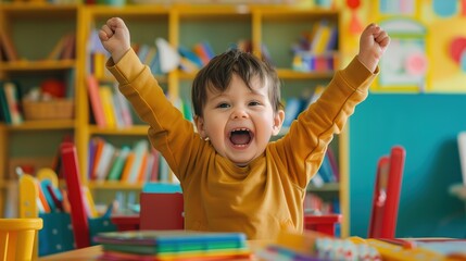 A joyful toddler in a colorful classroom, surrounded by books and learning materials, arms raised...