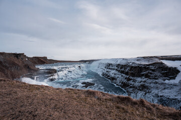 Snowy waterfall with ice