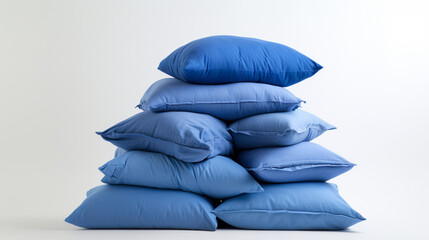 blue pillows stacked on top of each other, on a white background