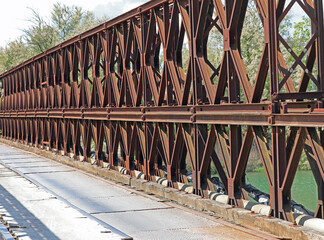 detail of Rusty iron railing on a high bridge preventing falls