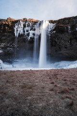 Snowy waterfall with ice