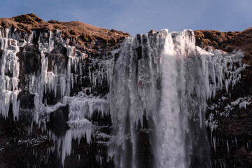 Snowy waterfall with ice