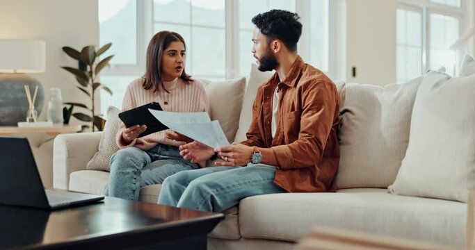Stress, paperwork and couple with fight and conflict from mortgage, budget and debt problem. Living room, marriage and argument from internet banking and bills document with divorce talk in a home