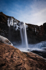 Snowy waterfall with ice