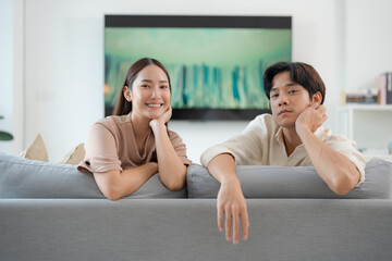 Young couple enjoying leisure time in living room